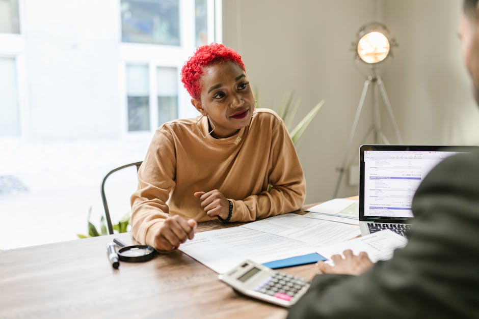 Professional woman engaged in thoughtful discussion at a business meeting indoors